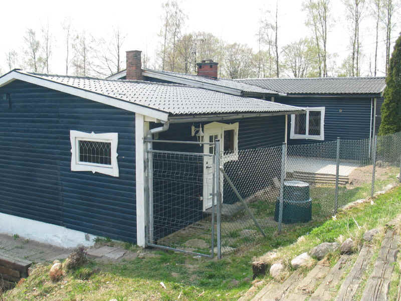 Achterkant: Sauna, Washok en Speelkamer zijn te zien